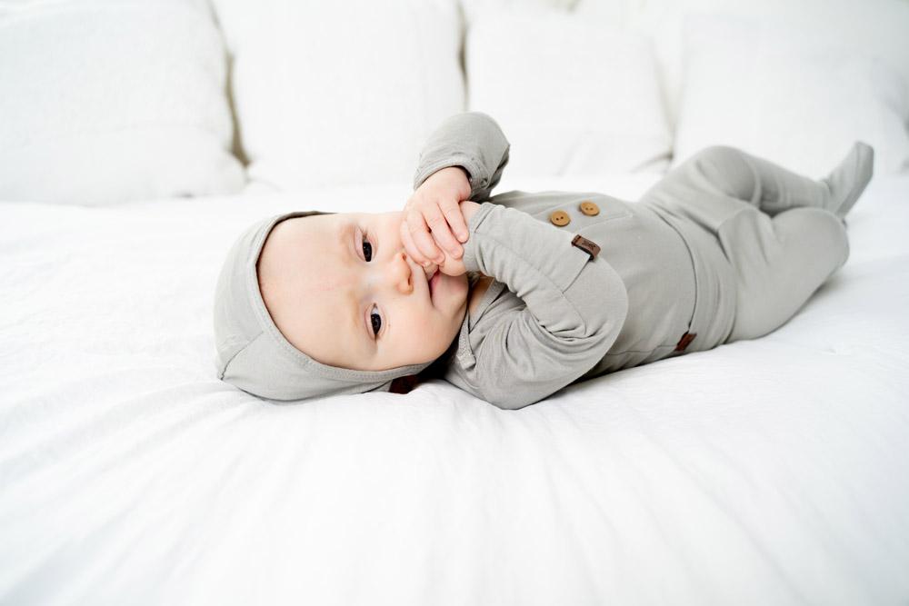 A cozy baby bonnet designed for warmth and comfort, featuring soft fabric and a snug fit, perfect for chilly weather.