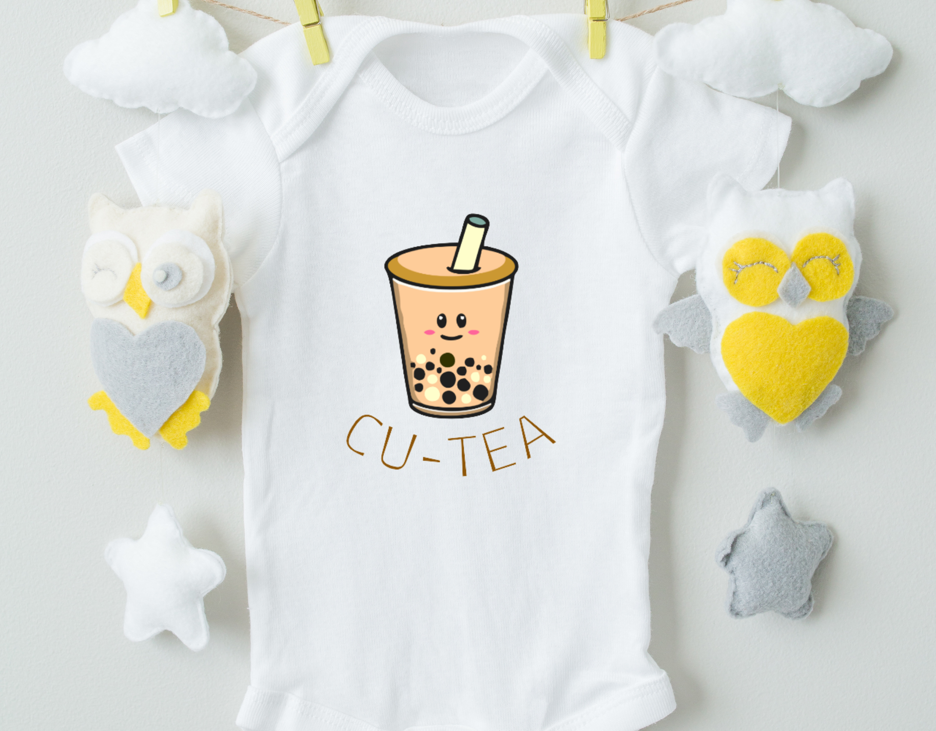 Bubble Tea Boy Organic Cotton Baby Bodysuit featuring a cute bubble tea design, made from 100% organic cotton with expandable neckline and snap closure.