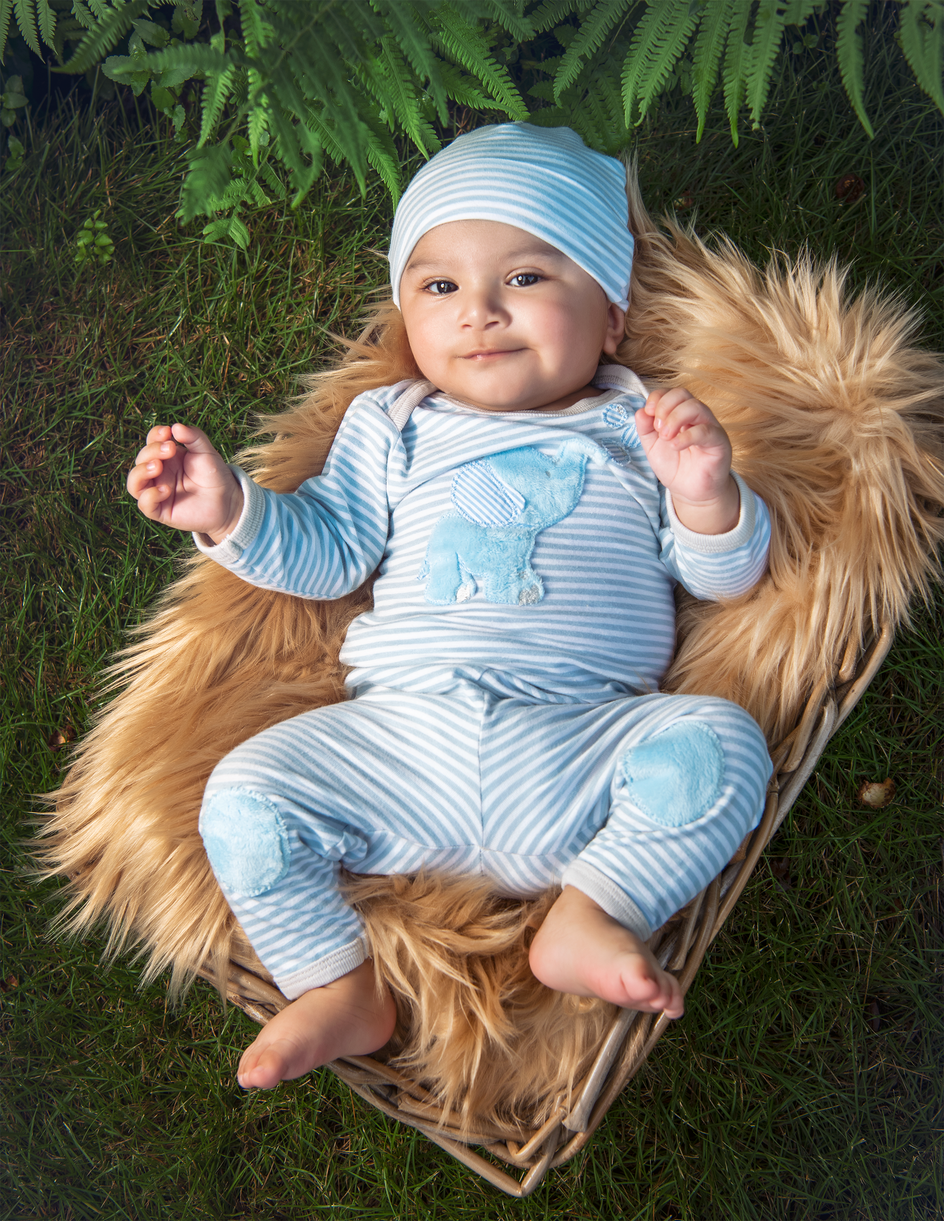 Bubbles Baby Boy Cap in blue, soft fabric, perfect for infants, styled with matching gown and blanket.