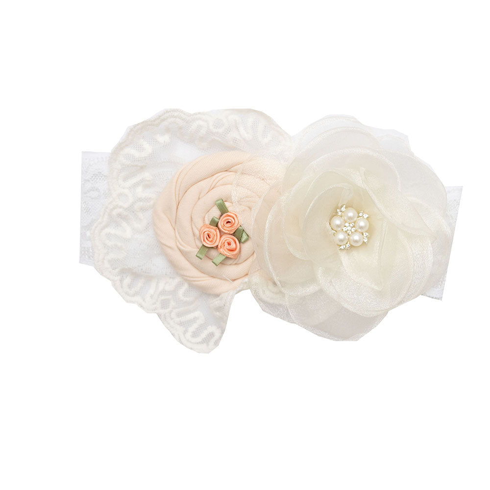 Caroline Headband in pastel peach with delicate rose embellishments, perfect for stylish outfits.