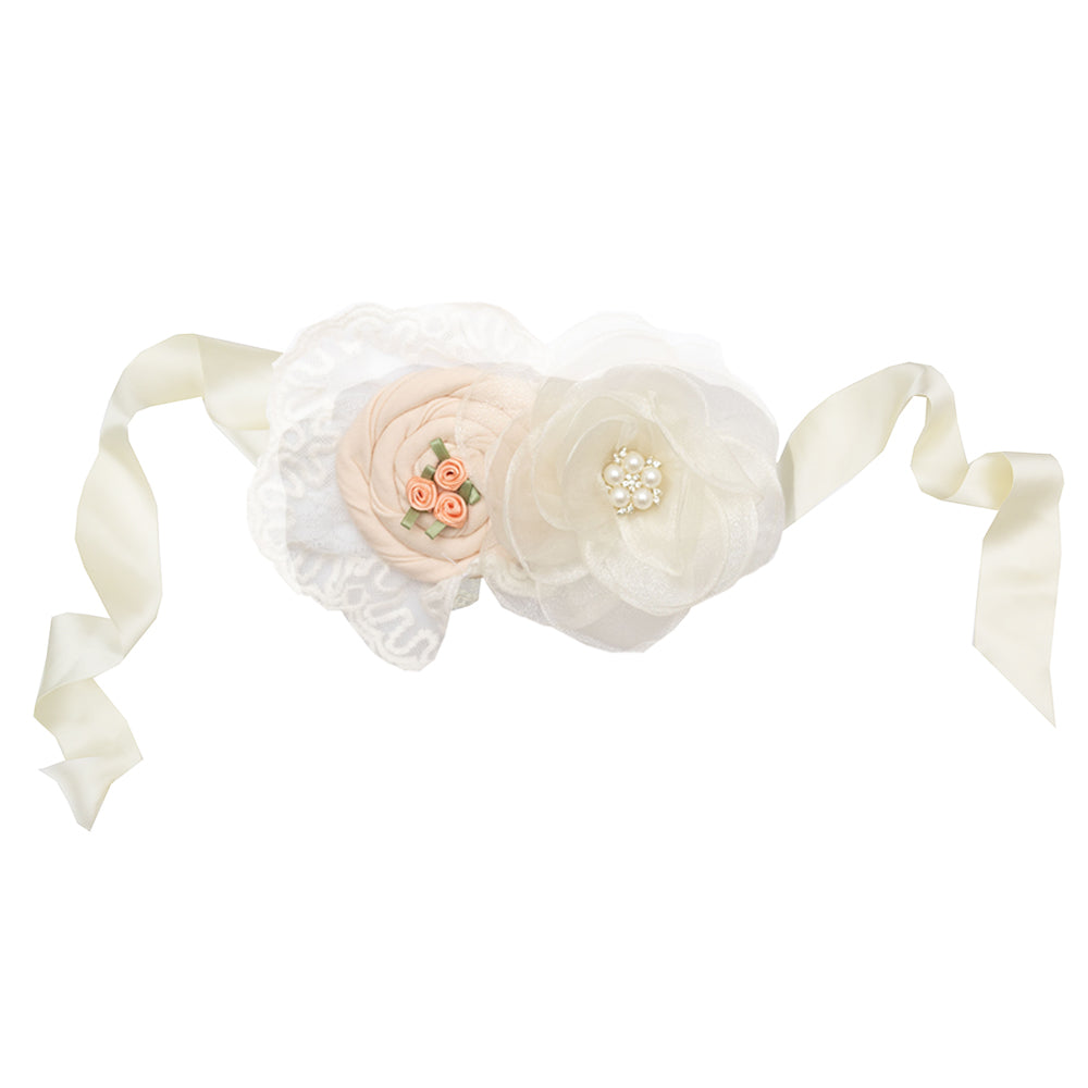 Pastel peach Caroline Sash with delicate rose embellishments, perfect for enhancing outfits.