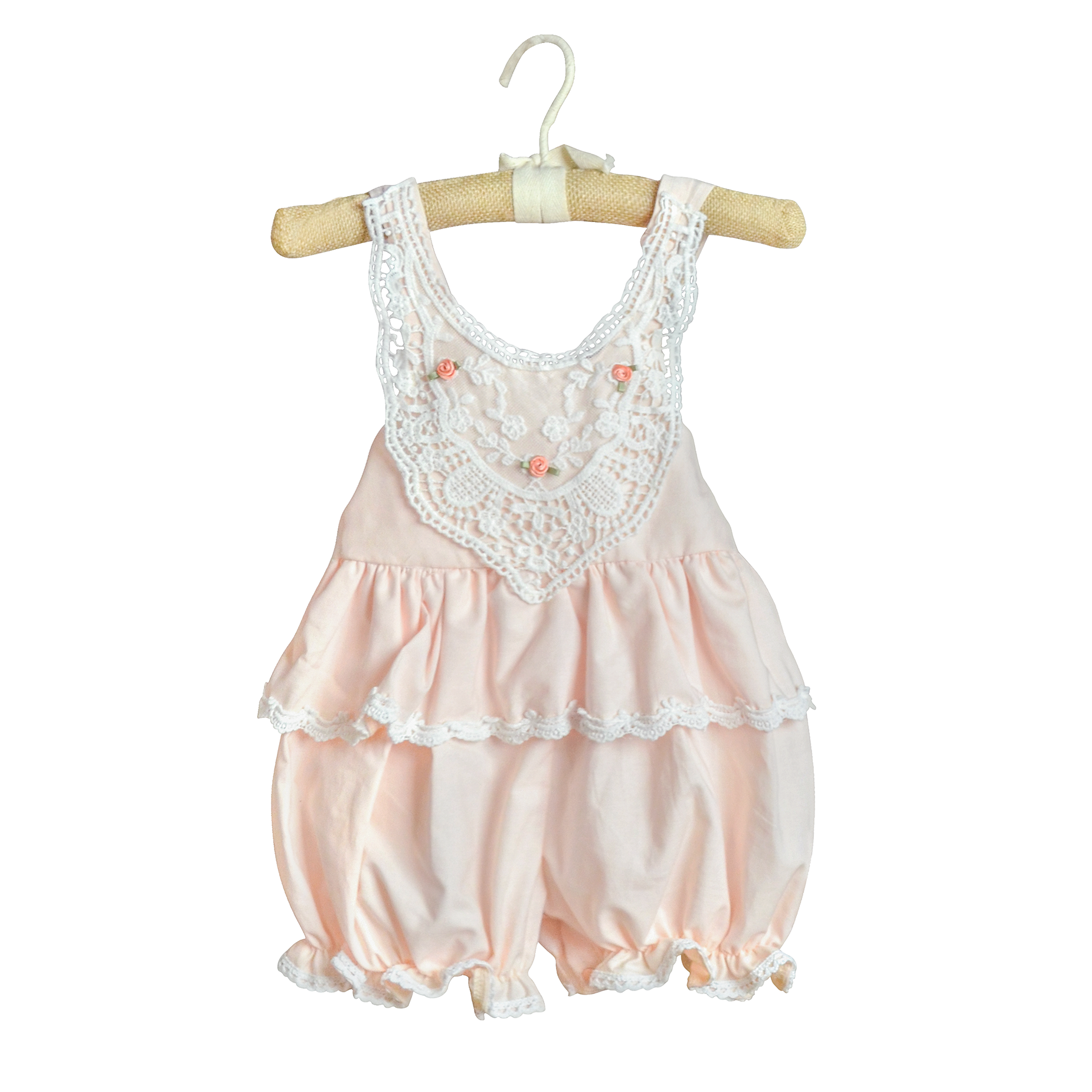 Caroline Sunsuit in pastel peach with delicate rose patterns, perfect for sunny occasions.