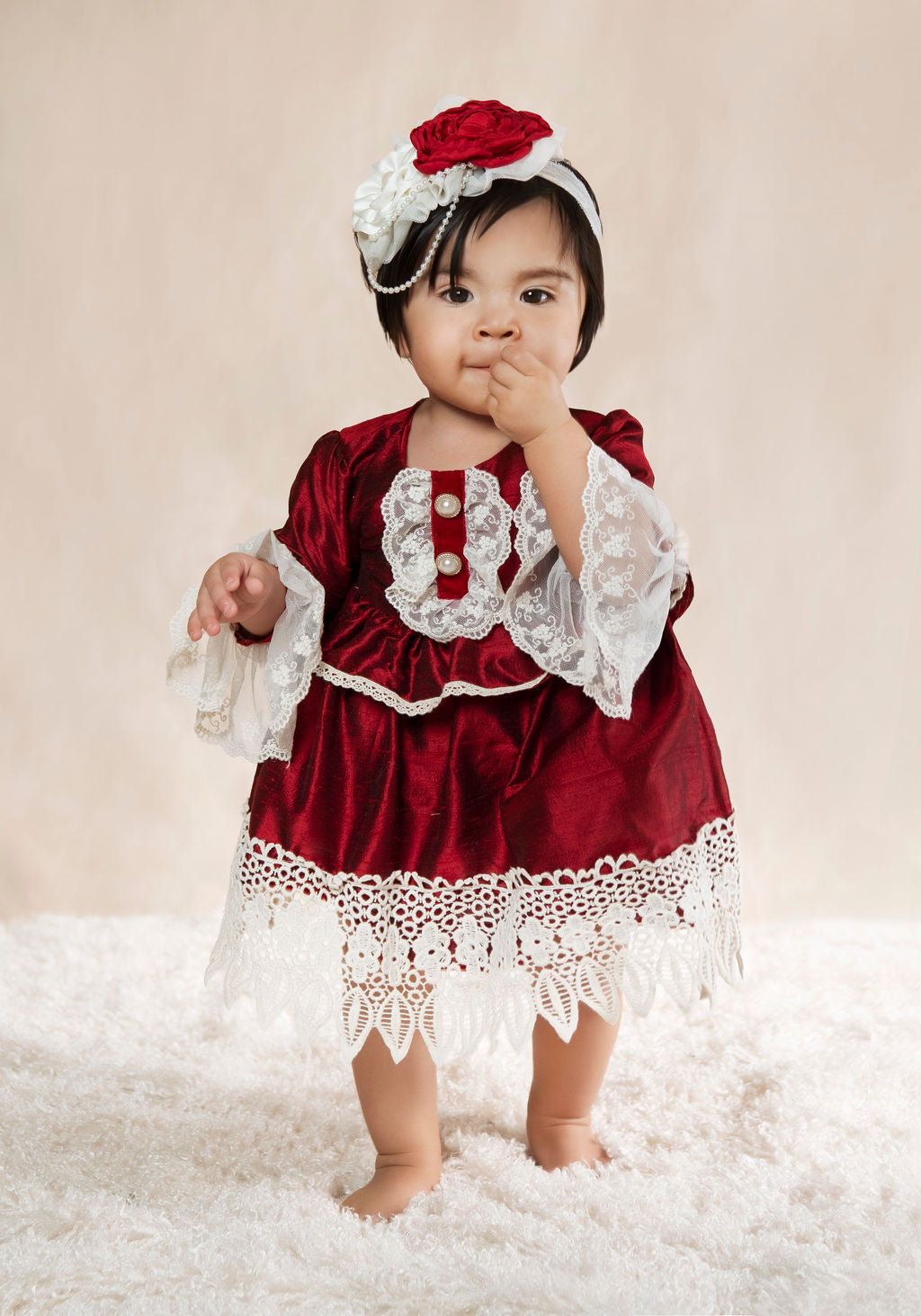 Colette Diaper Dress showcasing luxurious silky fabric that changes color in light, perfect for holiday parties.