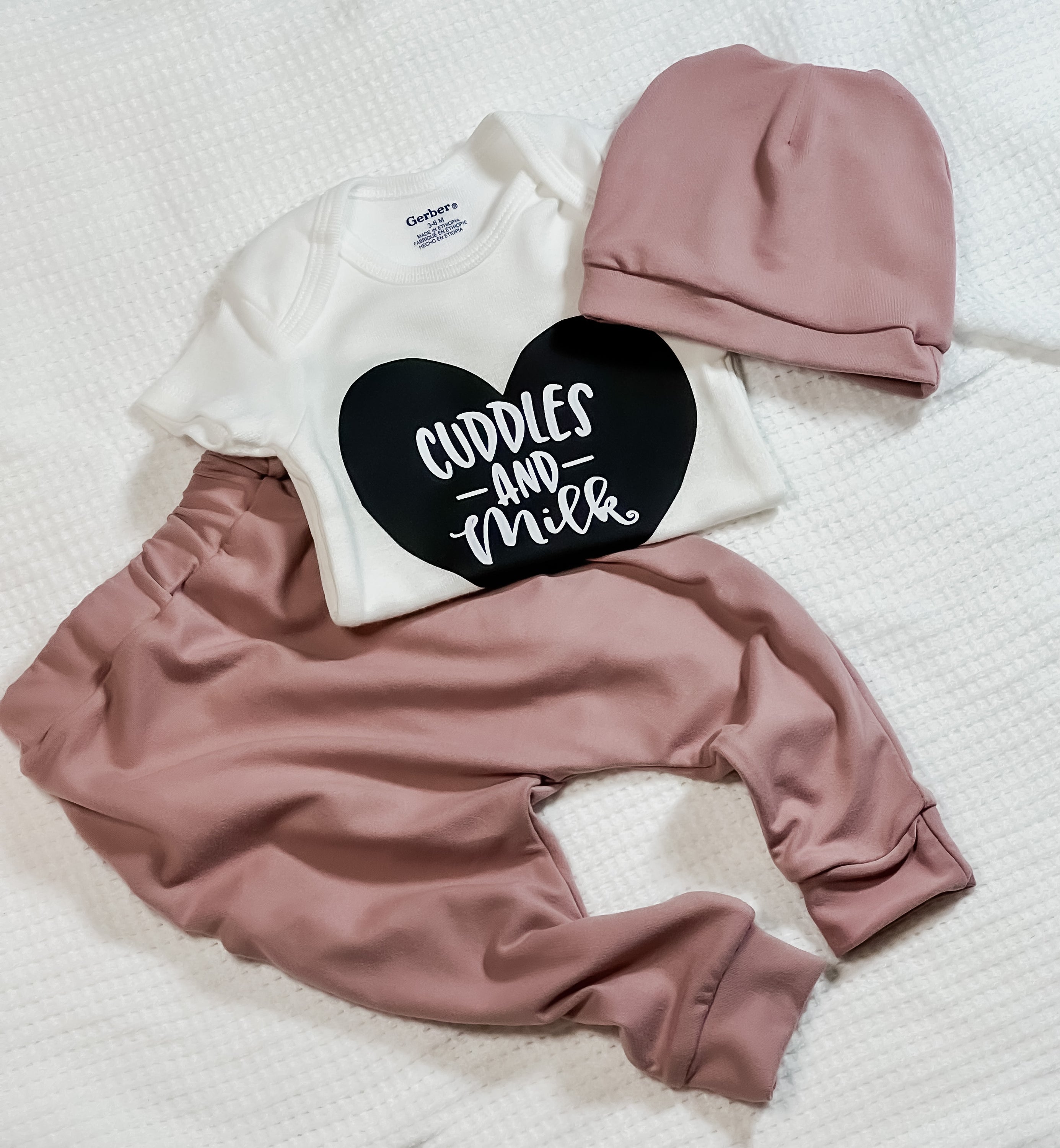 Cuddles and Milk Outfit featuring soft leggings and a cotton bodysuit, perfect for babies.