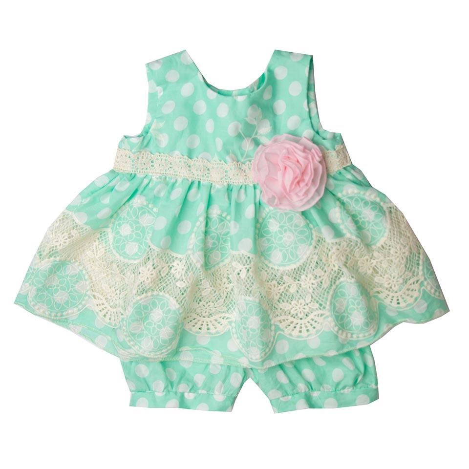 A stylish Dainty Dots Little Girls Short Set featuring a playful dot pattern, perfect for summer wear.