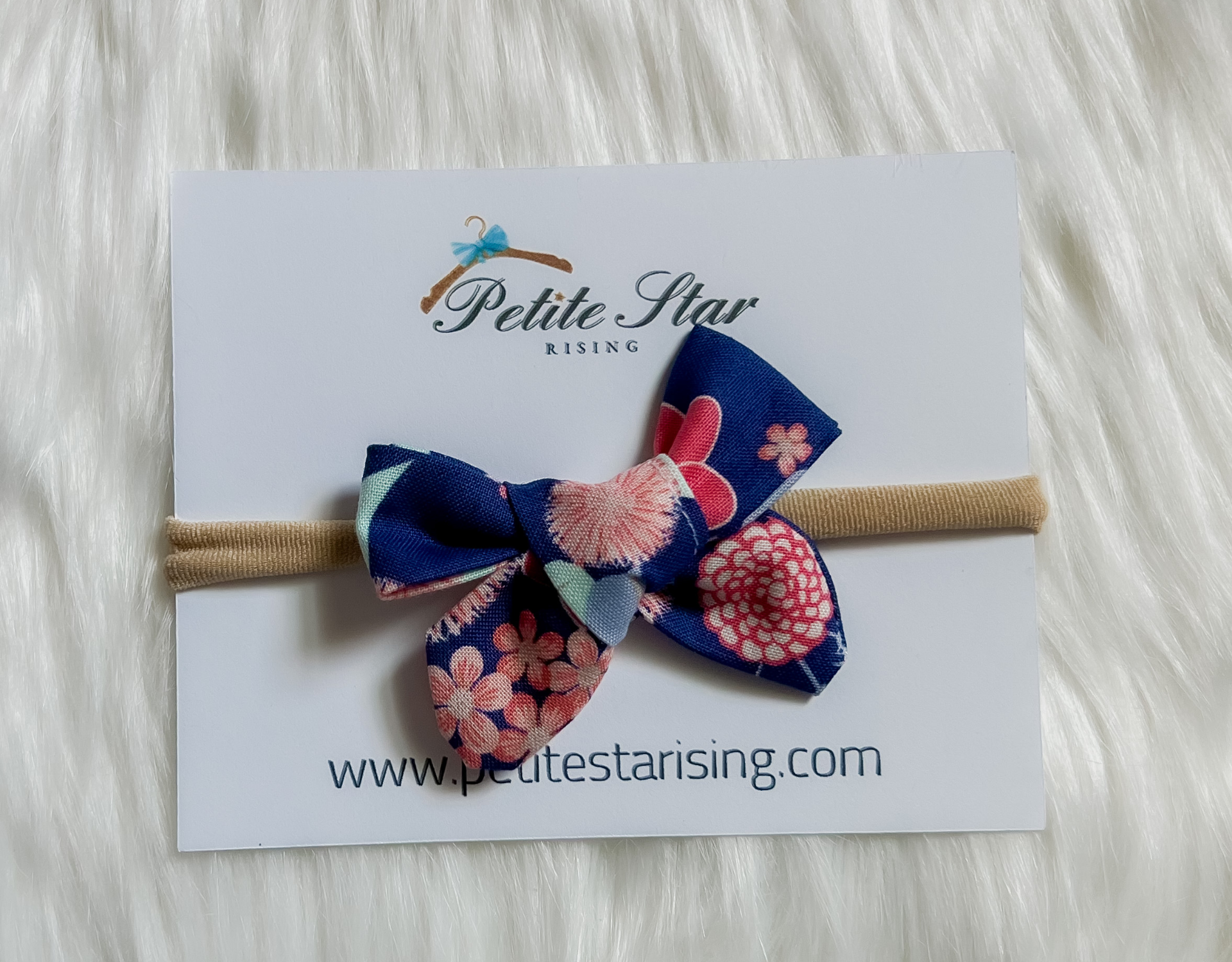 Dark Blue Floral Baby Headband featuring a delicate floral design on a soft nylon band, perfect for infants and toddlers.