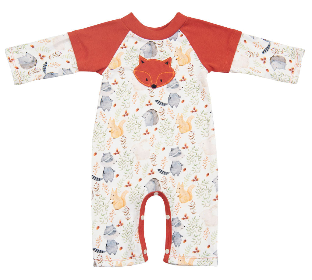 A cute baby wearing the Forest Friends Romper featuring playful forest animal prints, perfect for comfort and style.