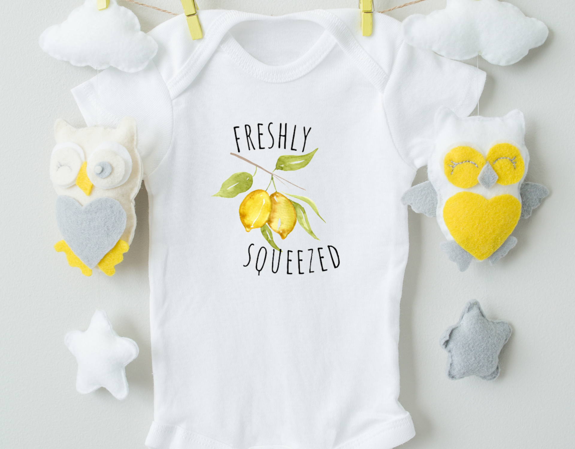 Freshly Squeezed Bodysuit made of 100% cotton with a vibrant heat transfer vinyl design, featuring an expandable neckline and snap closure.