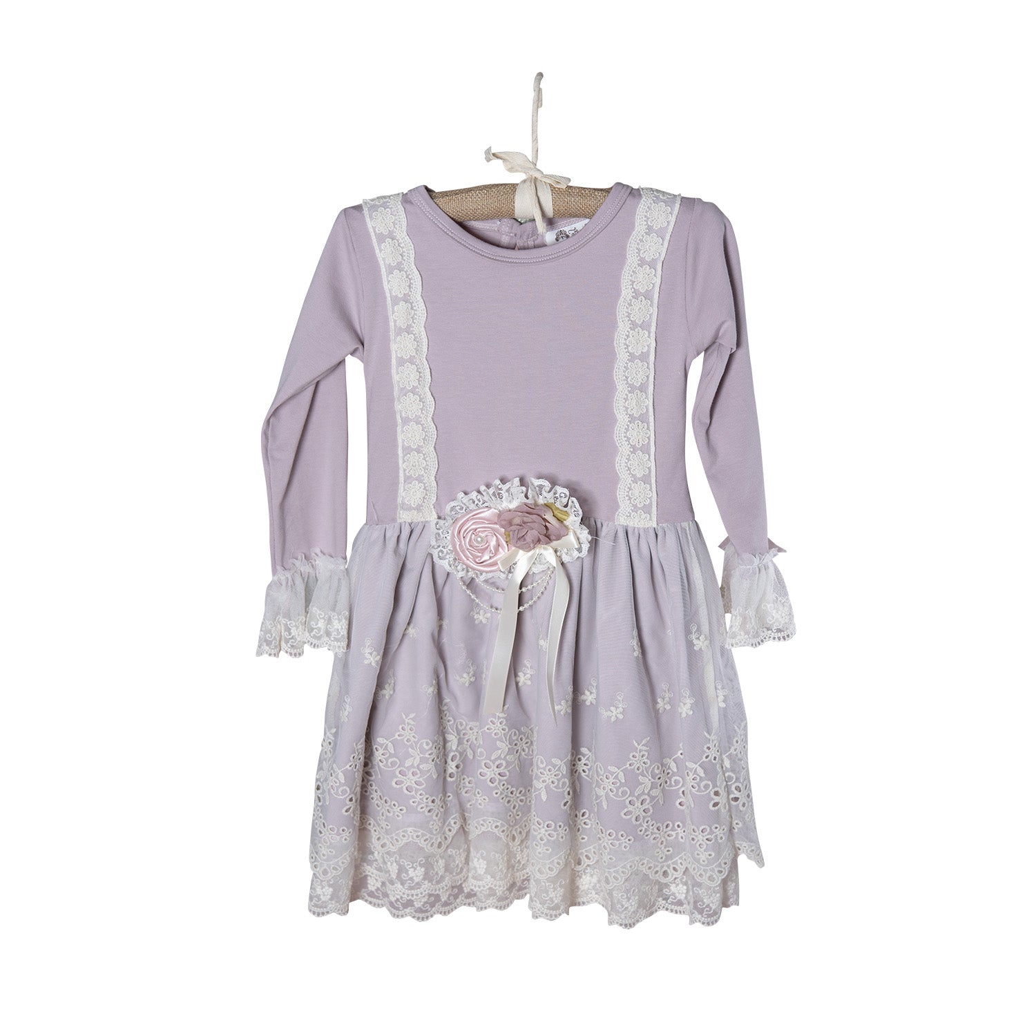 The Genevie Dress featuring creamy purple hues and intricate lace detailing, perfect for elegant occasions.