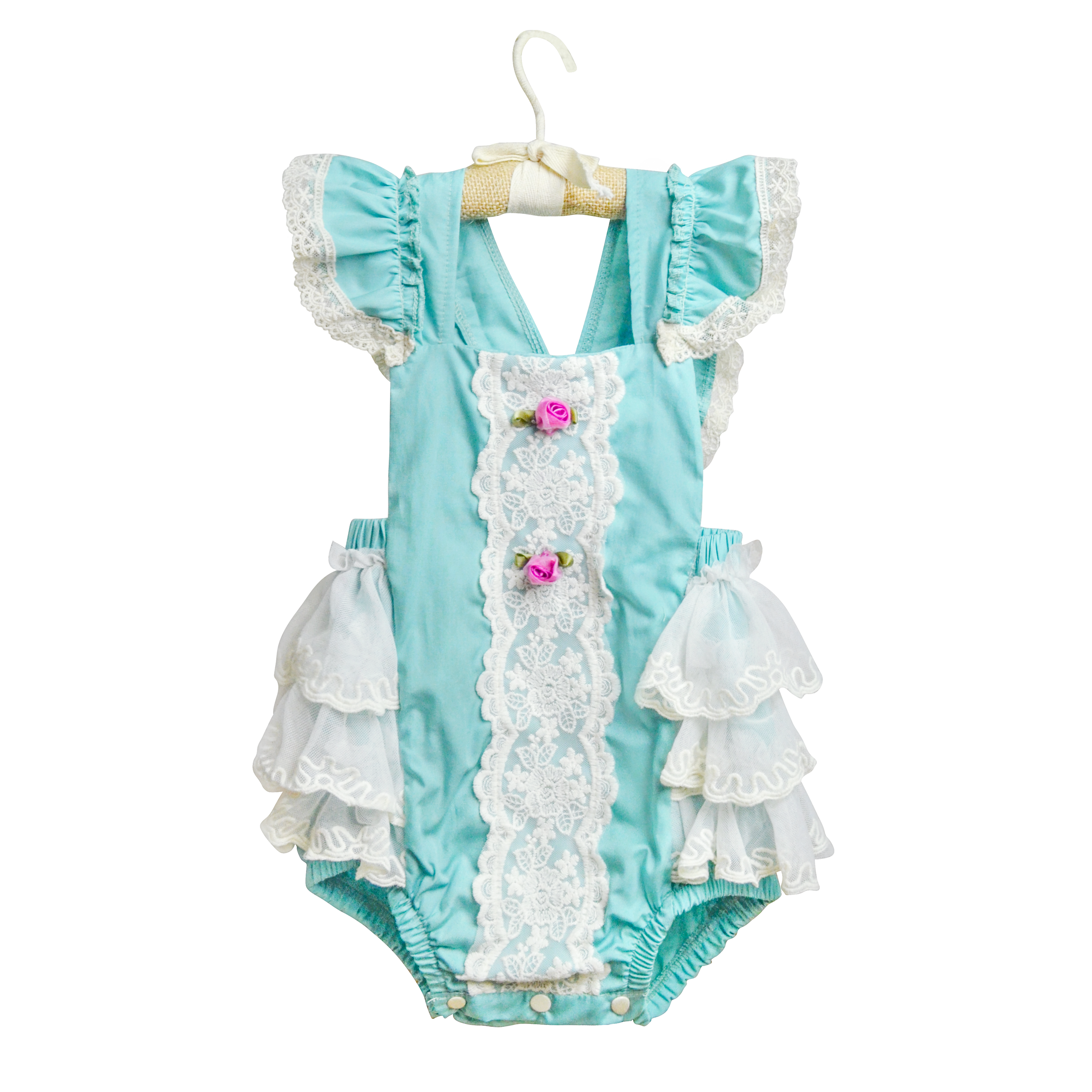 A beautiful turquoise sunsuit for girls featuring ruffles, lace, and rosettes, perfect for summer wear.