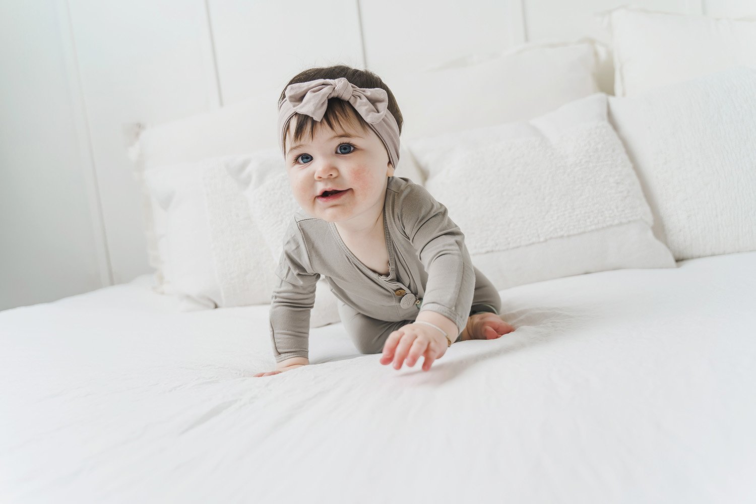 A soft and stretchy knotted bow accessory for babies, showcasing its stylish design and comfortable fit.