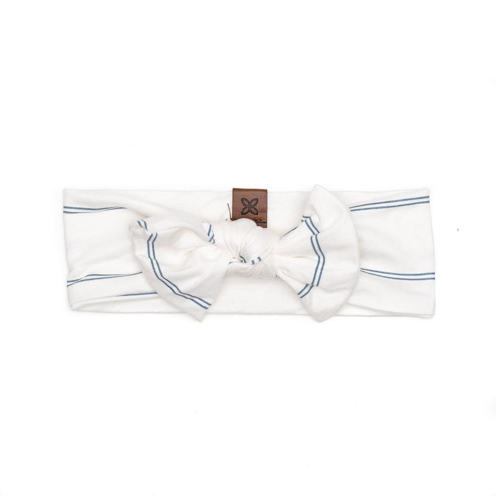 A soft and stretchy knotted bow accessory for babies, showcasing its stylish design and comfortable fit.