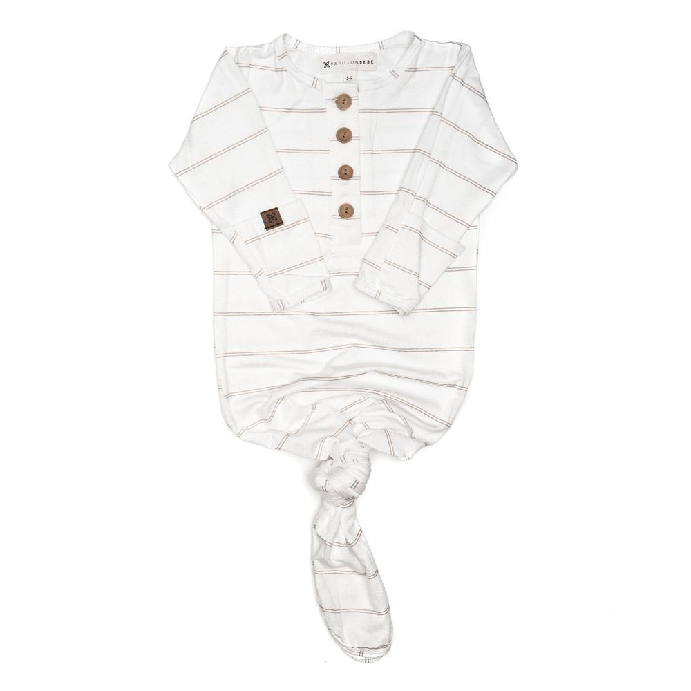 A soft and stylish knotted gown for babies, featuring functional buttons and a cozy design, perfect for diaper changes.