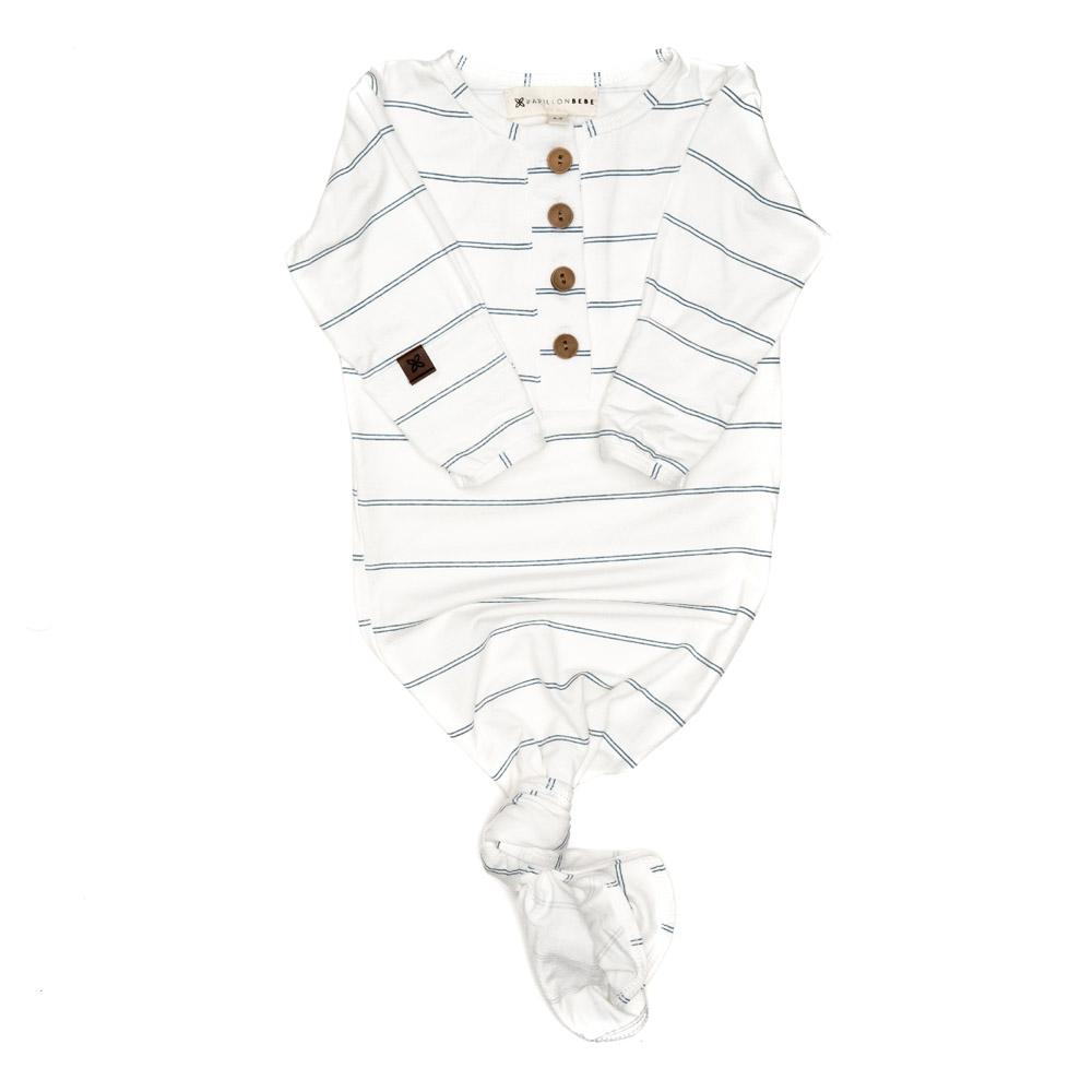 A soft and stylish knotted gown for babies, featuring functional buttons and a cozy design, perfect for diaper changes.