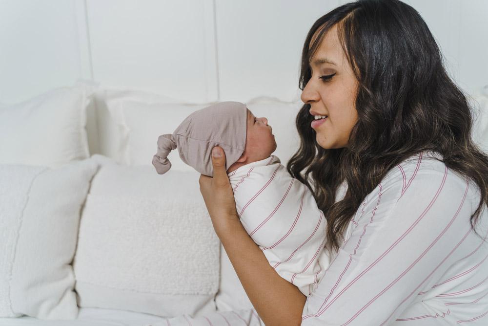 A soft, stylish knotted hat for babies, featuring a cute knot on top and made from a gentle fabric blend, perfect for keeping little heads warm.