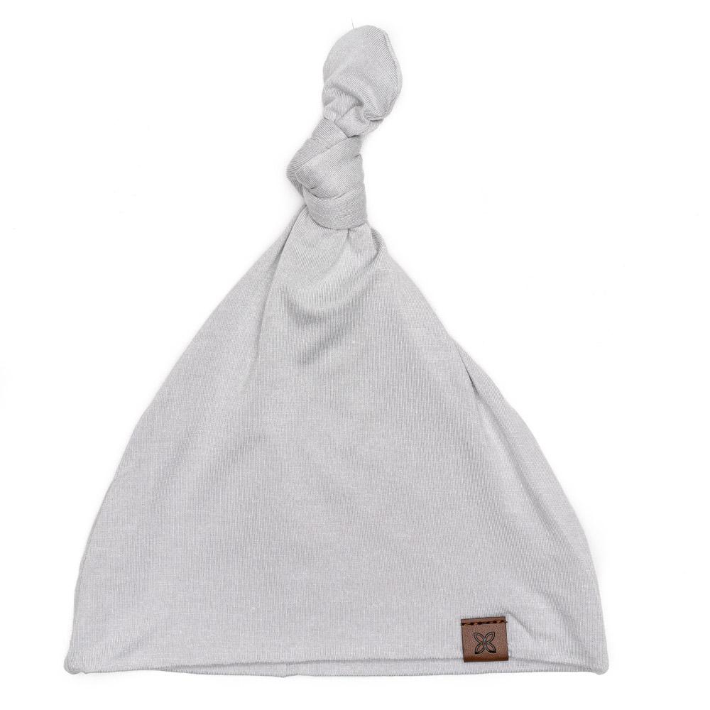 A soft, stylish knotted hat for babies, featuring a cute knot on top and made from a gentle fabric blend, perfect for keeping little heads warm.