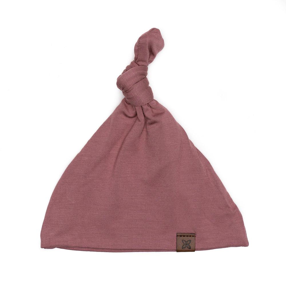 A soft, stylish knotted hat for babies, featuring a cute knot on top and made from a gentle fabric blend, perfect for keeping little heads warm.