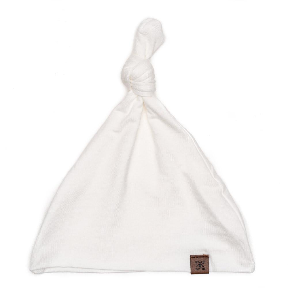 A soft, stylish knotted hat for babies, featuring a cute knot on top and made from a gentle fabric blend, perfect for keeping little heads warm.