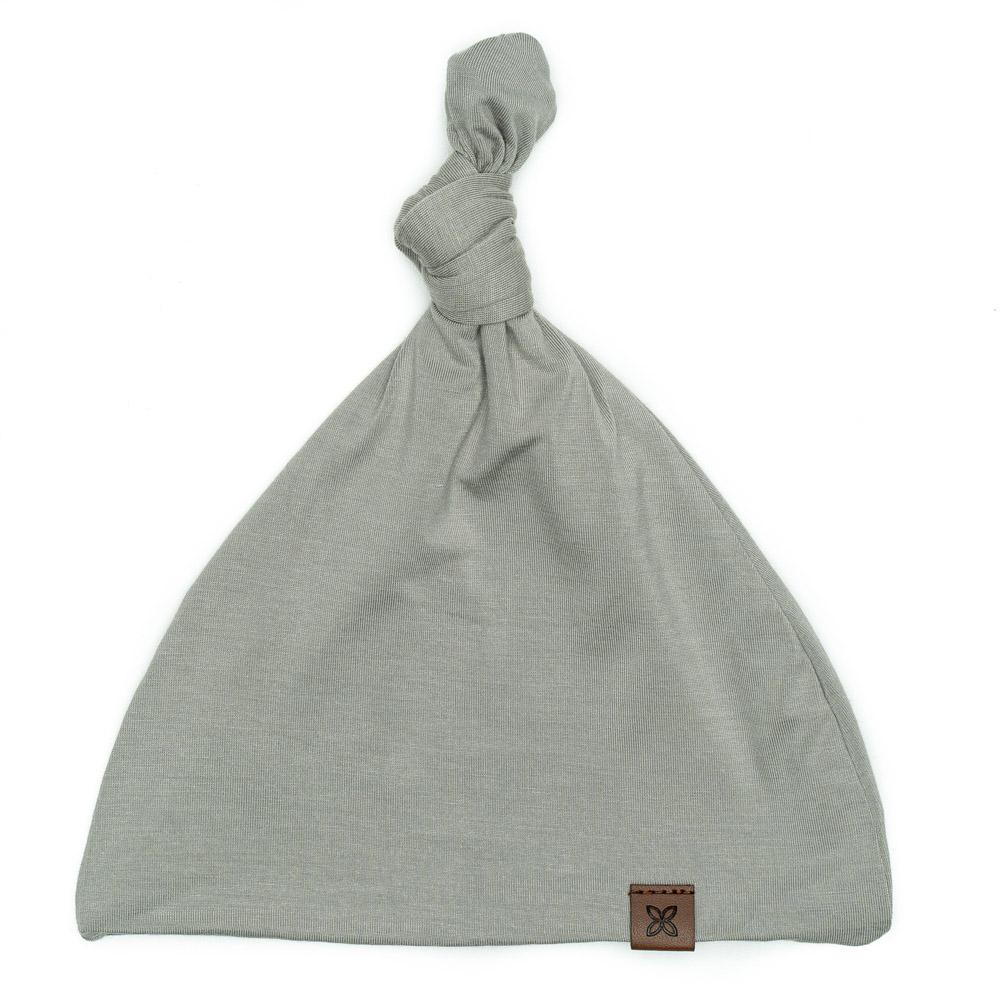 A soft, stylish knotted hat for babies, featuring a cute knot on top and made from a gentle fabric blend, perfect for keeping little heads warm.