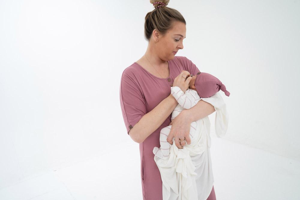 A soft, stylish knotted hat for babies, featuring a cute knot on top and made from a gentle fabric blend, perfect for keeping little heads warm.