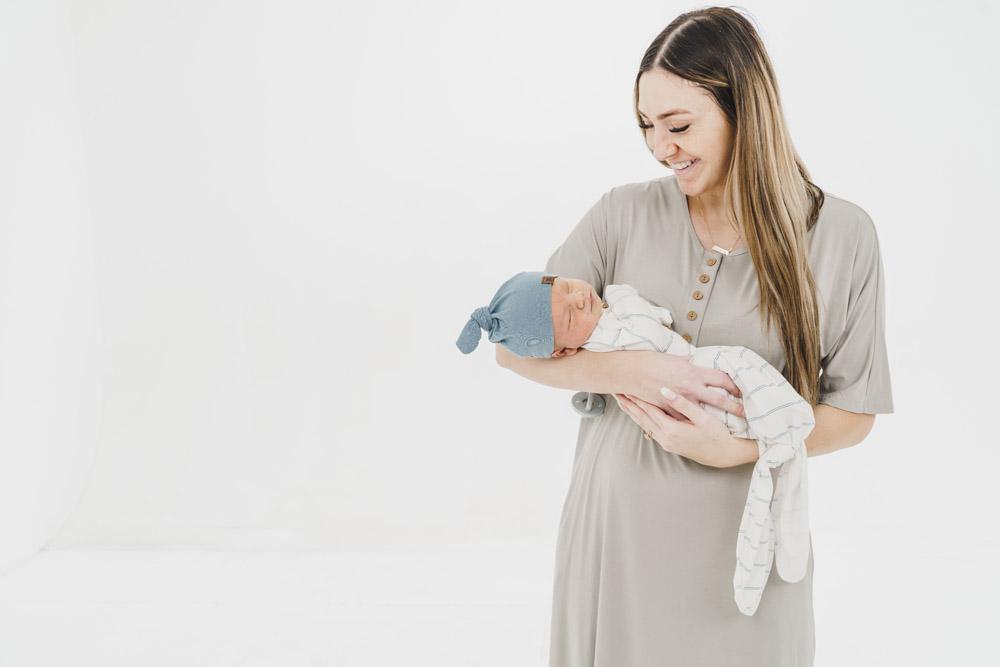 A soft, stylish knotted hat for babies, featuring a cute knot on top and made from a gentle fabric blend, perfect for keeping little heads warm.