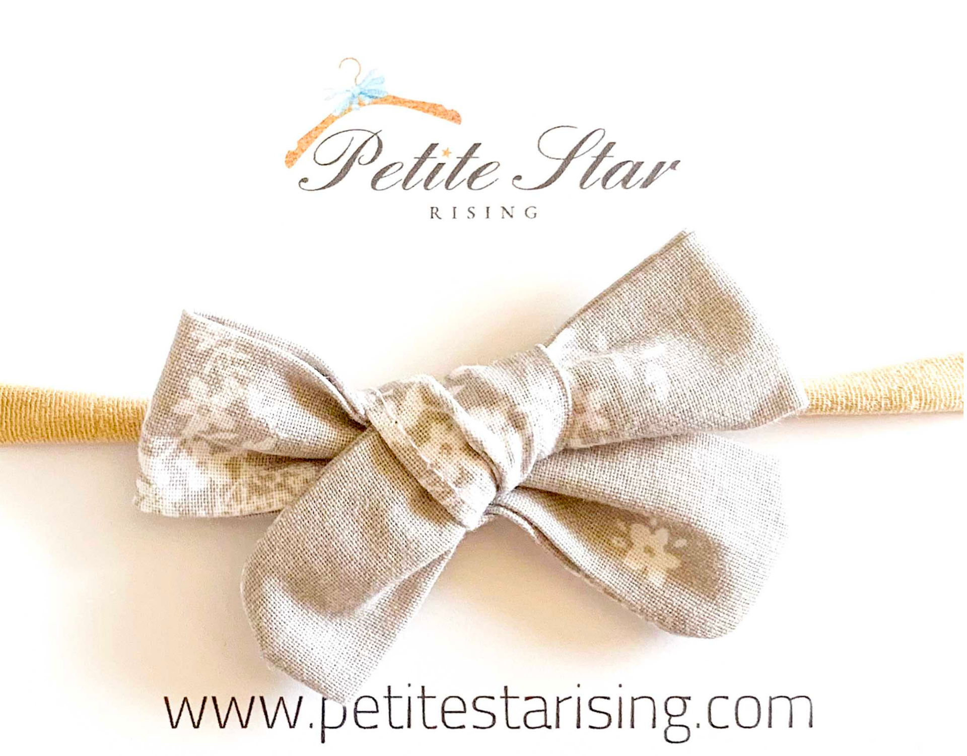 Light Gray Floral Baby Headband featuring a delicate floral bow on a soft nylon band, perfect for infants and toddlers.