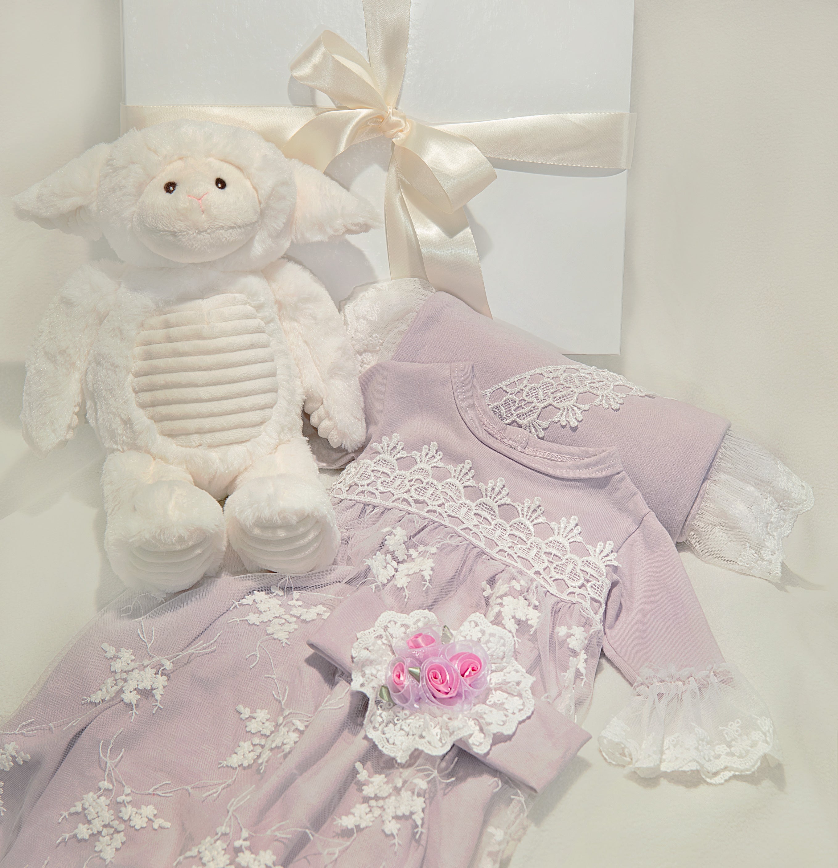 Lilac Mist set featuring a gown, blanket, headband, and plush toy in soft lilac color.