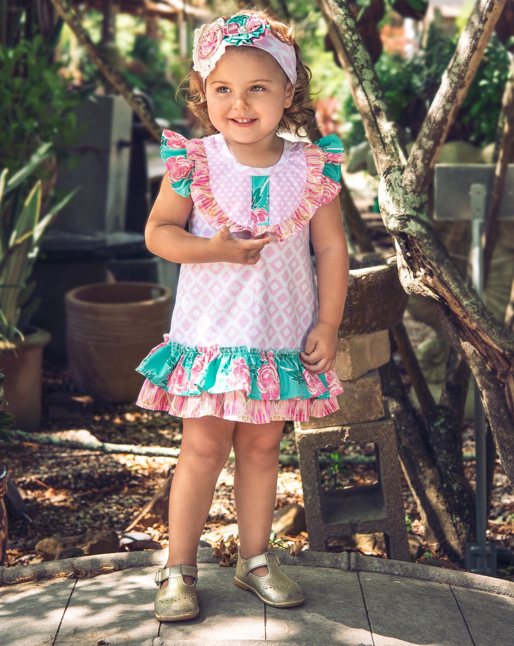 A beautiful Lily's Lawn Baby Dress featuring soft fabric and charming design, perfect for baby girls.