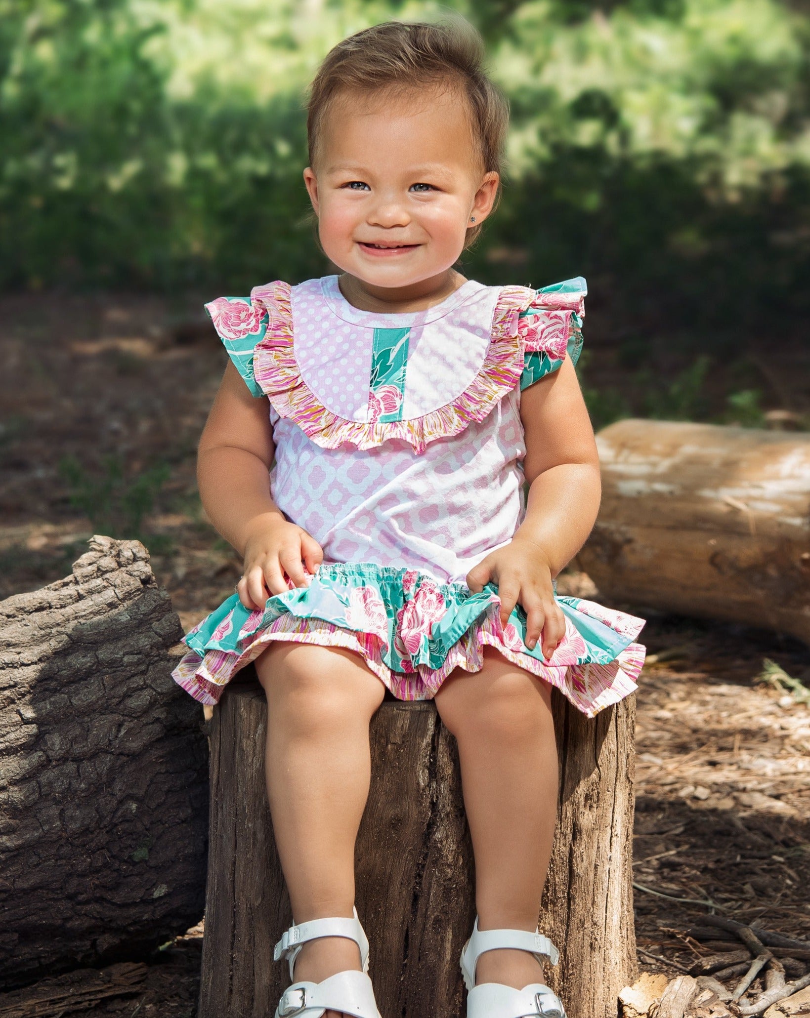 A beautiful Lily's Lawn Baby Dress featuring soft fabric and charming design, perfect for baby girls.