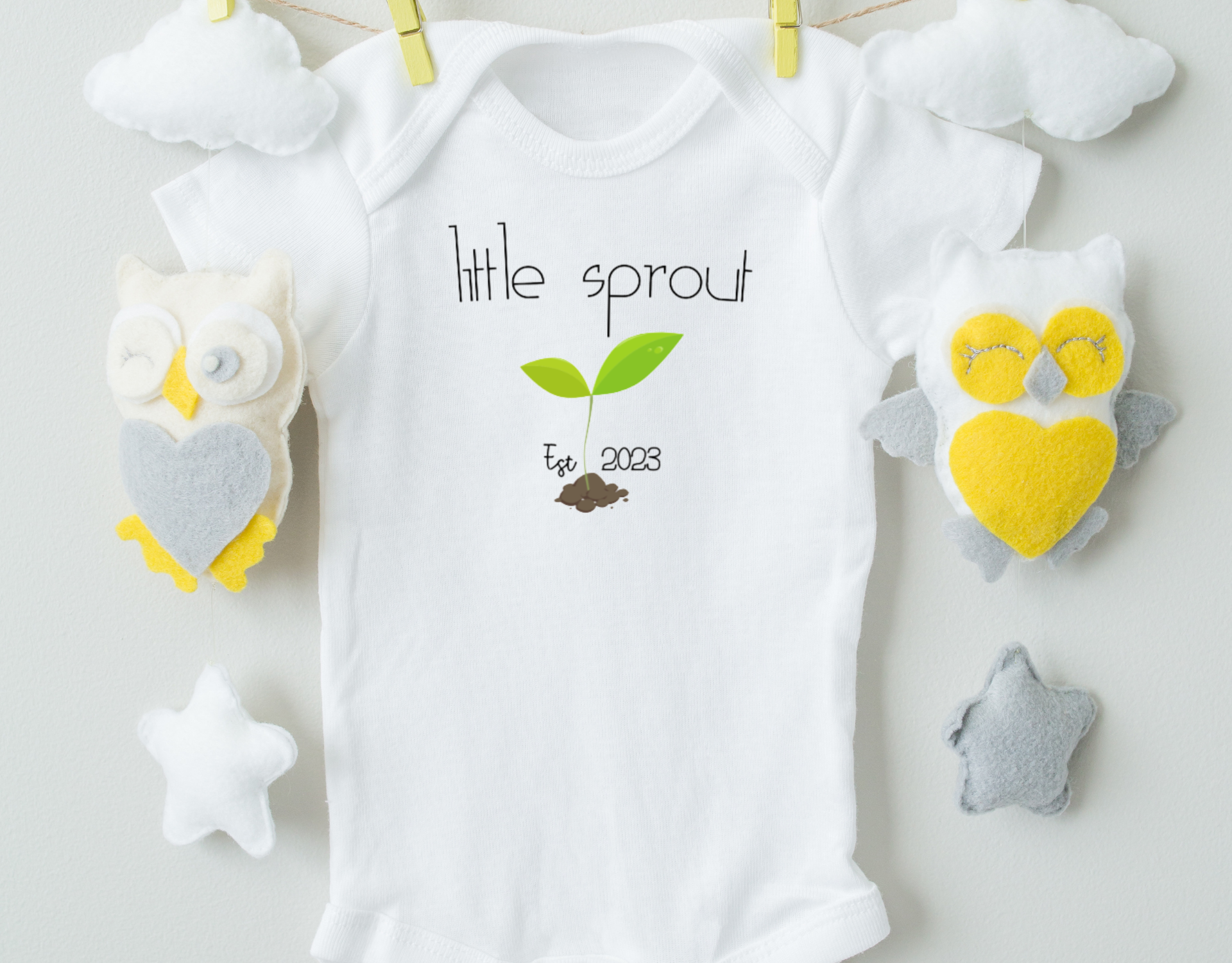 Little Sprout Bodysuit made from organic cotton with a heat transfer vinyl design, featuring an expandable neckline and snap closure.