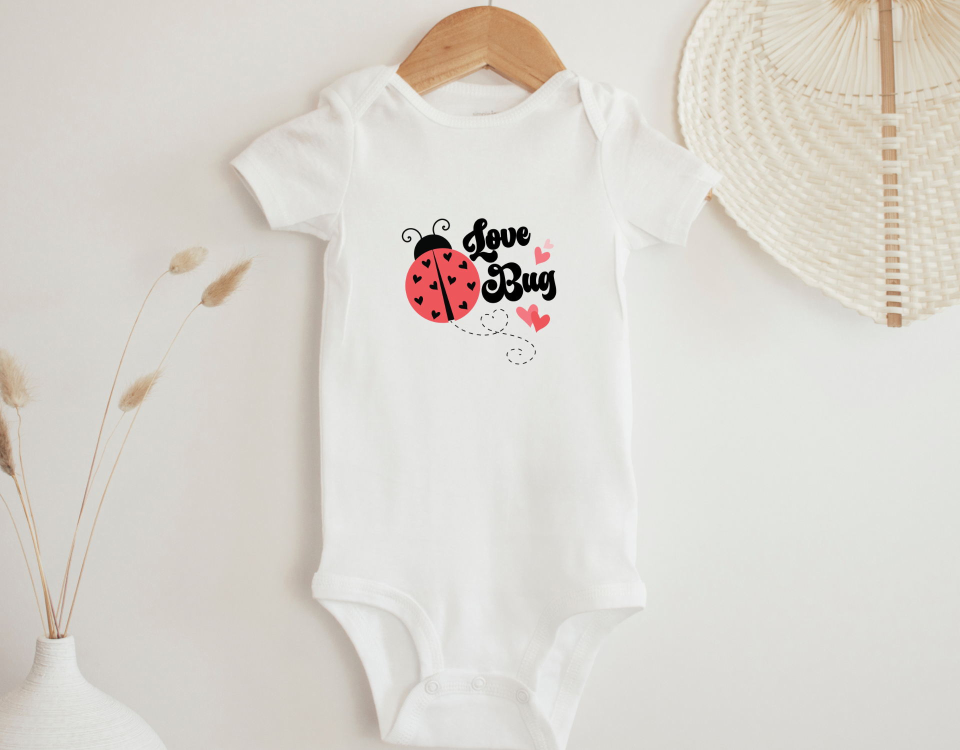 Adorable Love Bug Bodysuit for babies, featuring a cute love bug design on a soft cotton onesie.