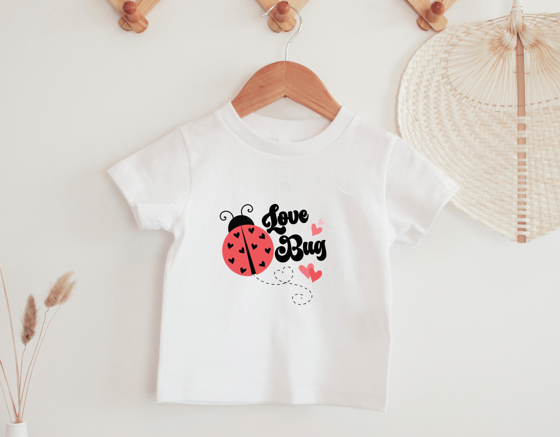 Adorable Love Bug Toddler Shirt featuring a cute love bug design, perfect for Valentine's Day gifts.