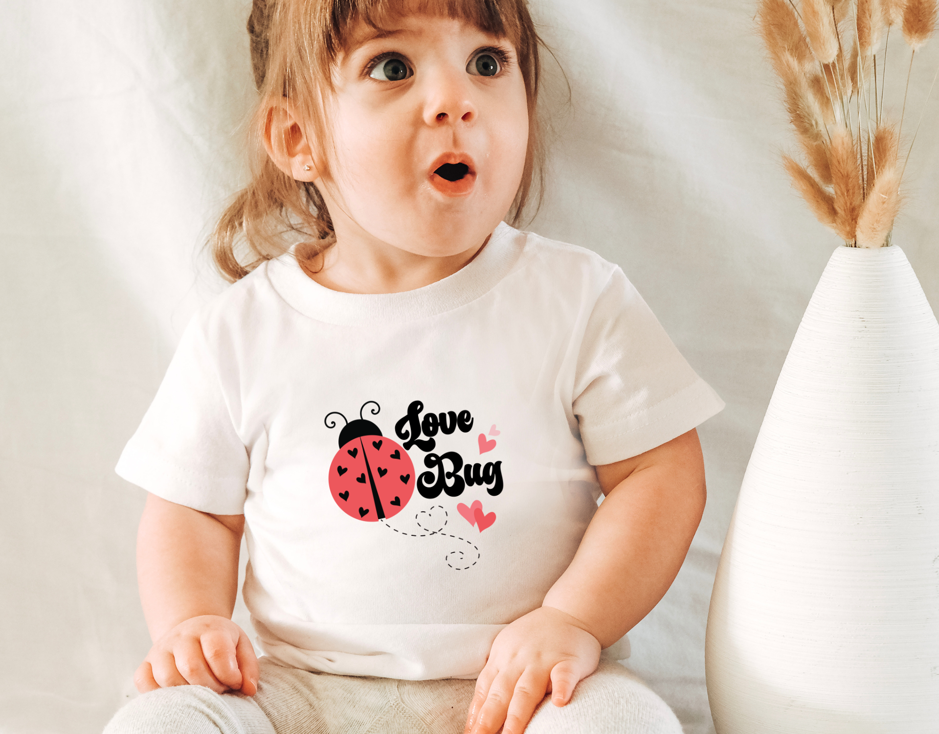 Adorable Love Bug Toddler Shirt featuring a cute love bug design, perfect for Valentine's Day gifts.