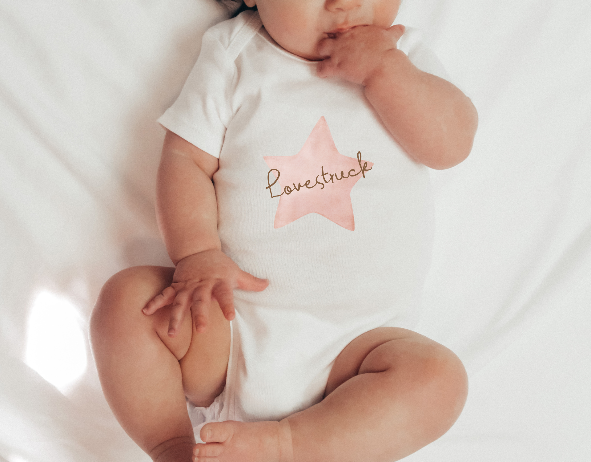 Lovestruck Bodysuit for newborns, featuring a cute design and made from 100% cotton, perfect for babies.