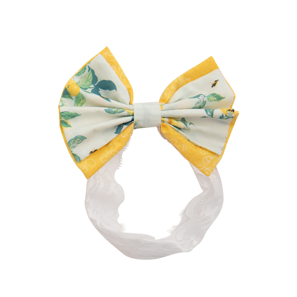 Lucy's Lemonade Headband featuring a vibrant lemonade-inspired design, perfect for casual and sporty looks.