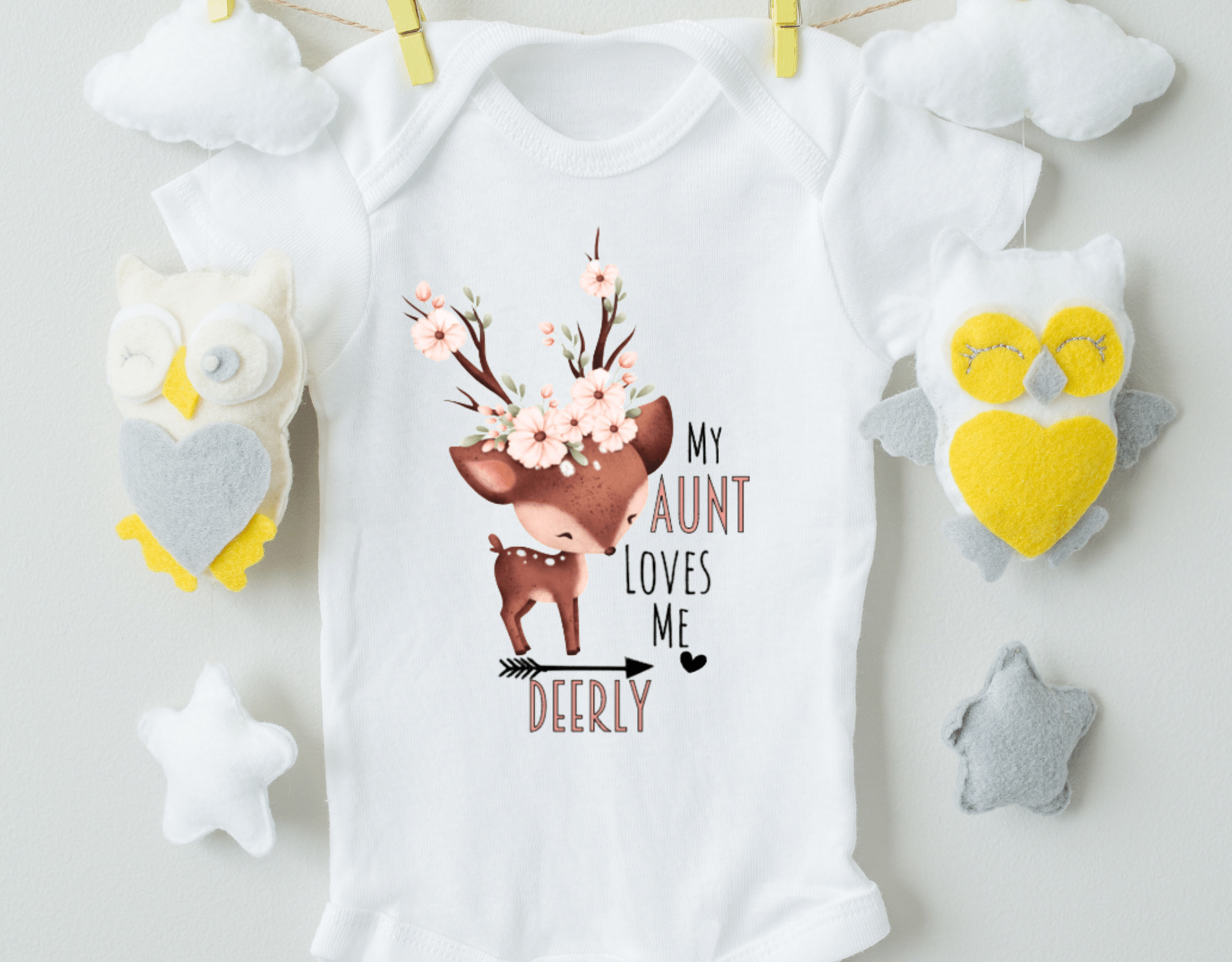 My Aunt Loves Me Deerly Bodysuit in organic cotton with heat transfer vinyl design, featuring an expandable neckline and snap closure.