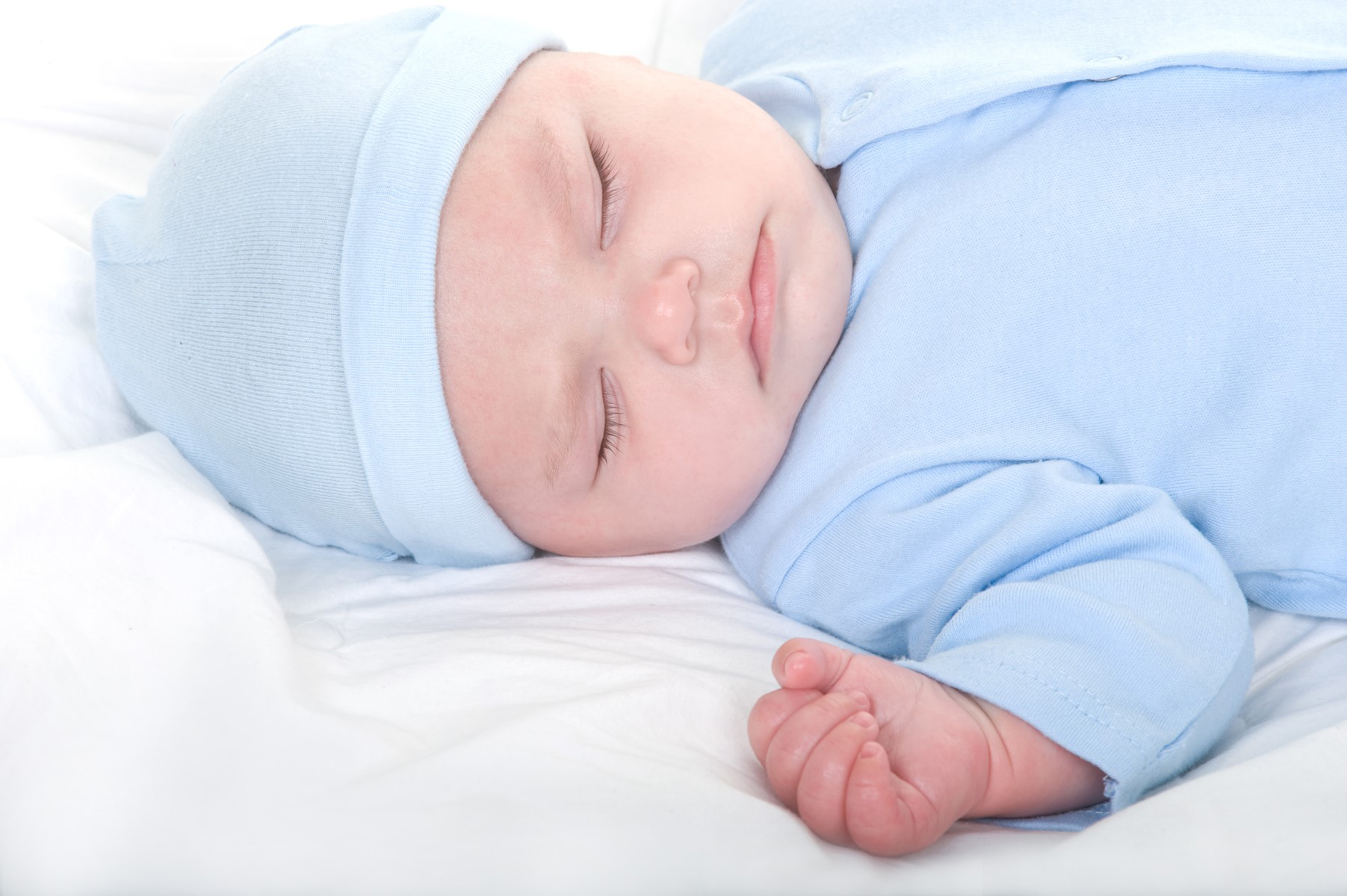 A 23-piece layette set for newborn baby boys, featuring soft cotton onesies and essential clothing items in a cheerful yellow color.