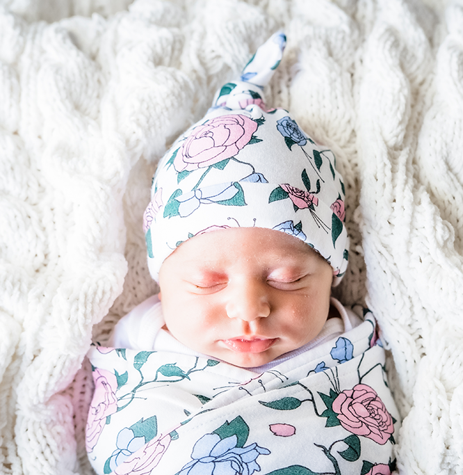 Organic Baby Beanie in floral design made from 100% GOTS organic cotton, perfect for keeping babies warm.