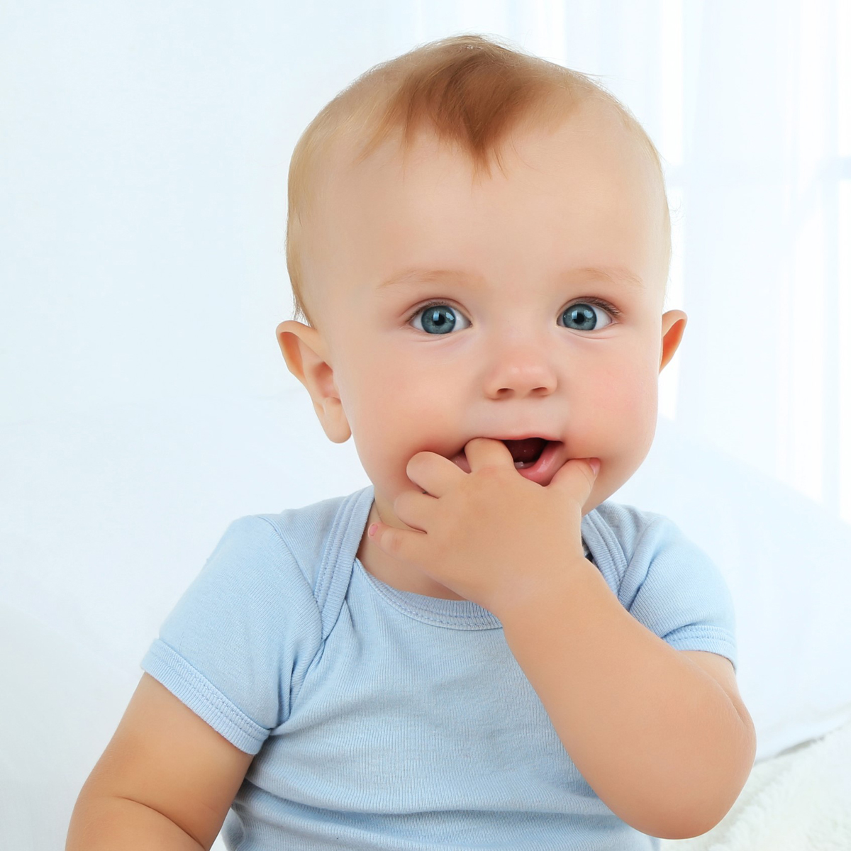 A pack of pastel-colored boys' short sleeve onesies made from soft cotton rib knit fabric, perfect for spring and Easter.