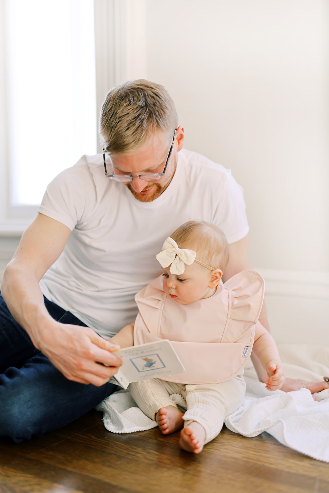 Peach Blush Ruffle Angel Bib showcasing its elegant design and practical features, perfect for baby mealtime.