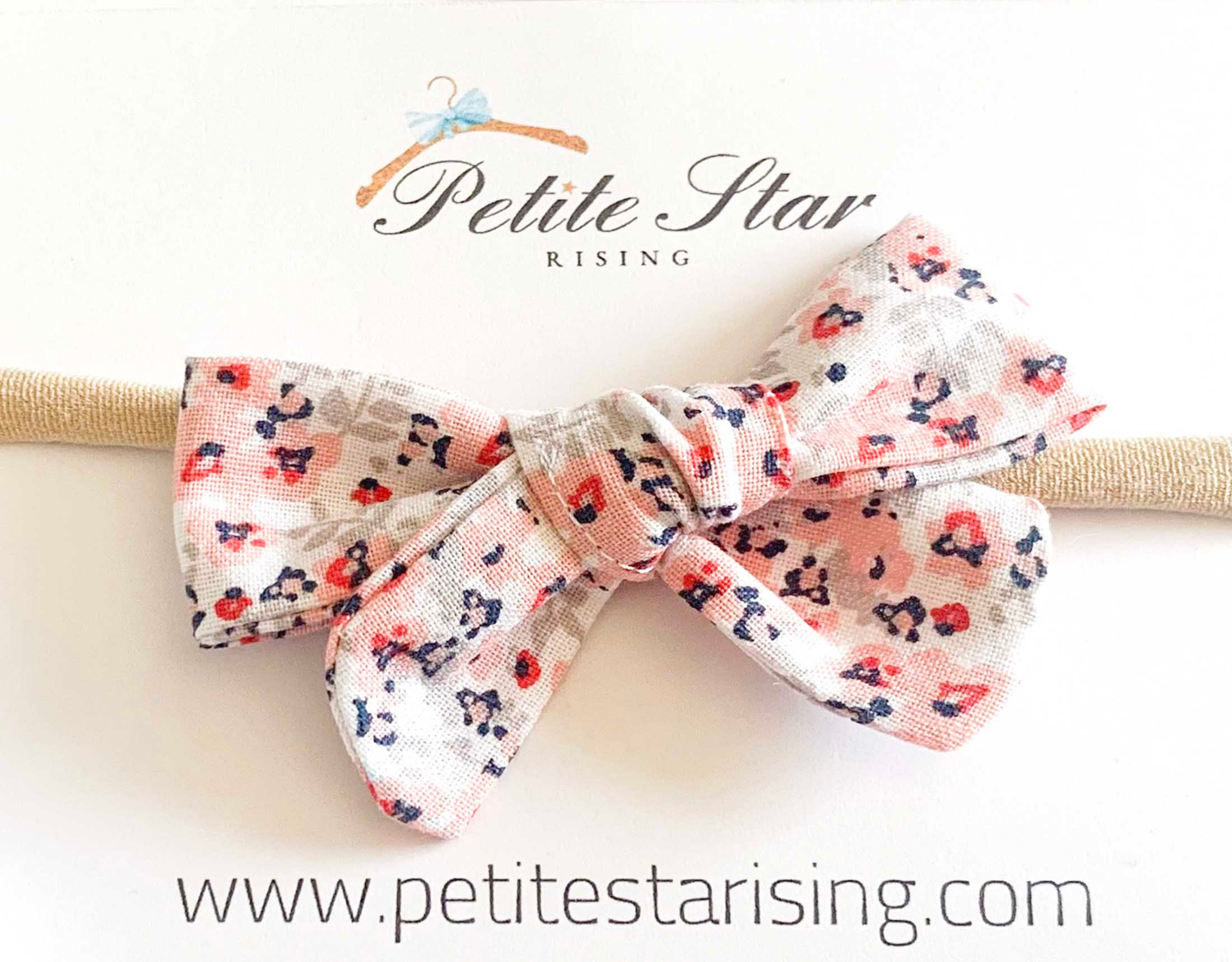 Pink Floral Baby Headband featuring a delicate floral design on a soft nylon band, perfect for infants.