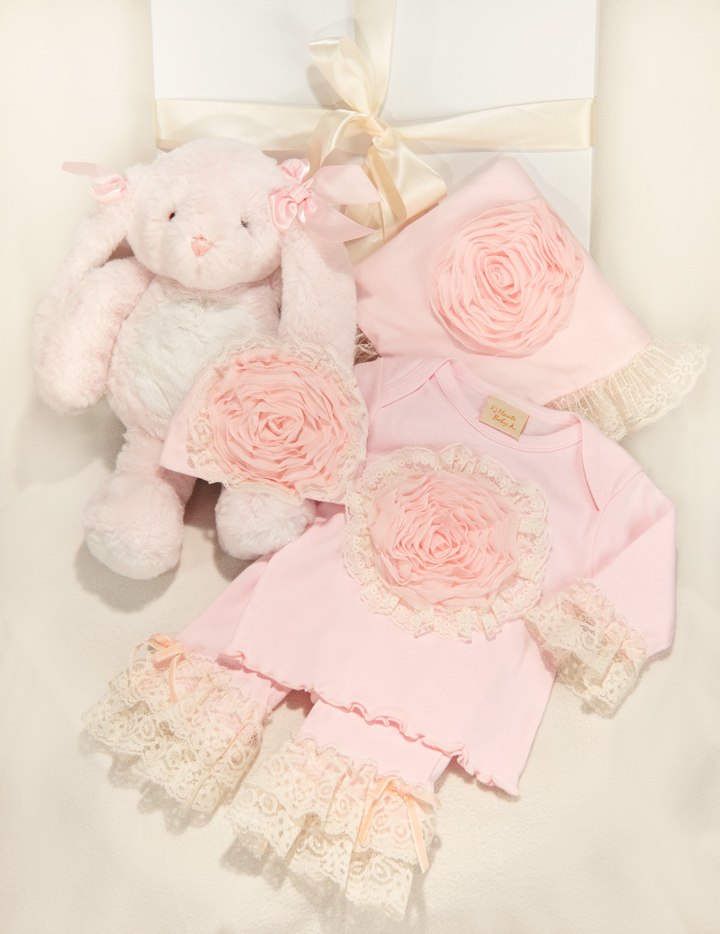 Pink Lullabye Legging Gift Set featuring leggings, blanket, cap, and plush toy in soft pink colors.