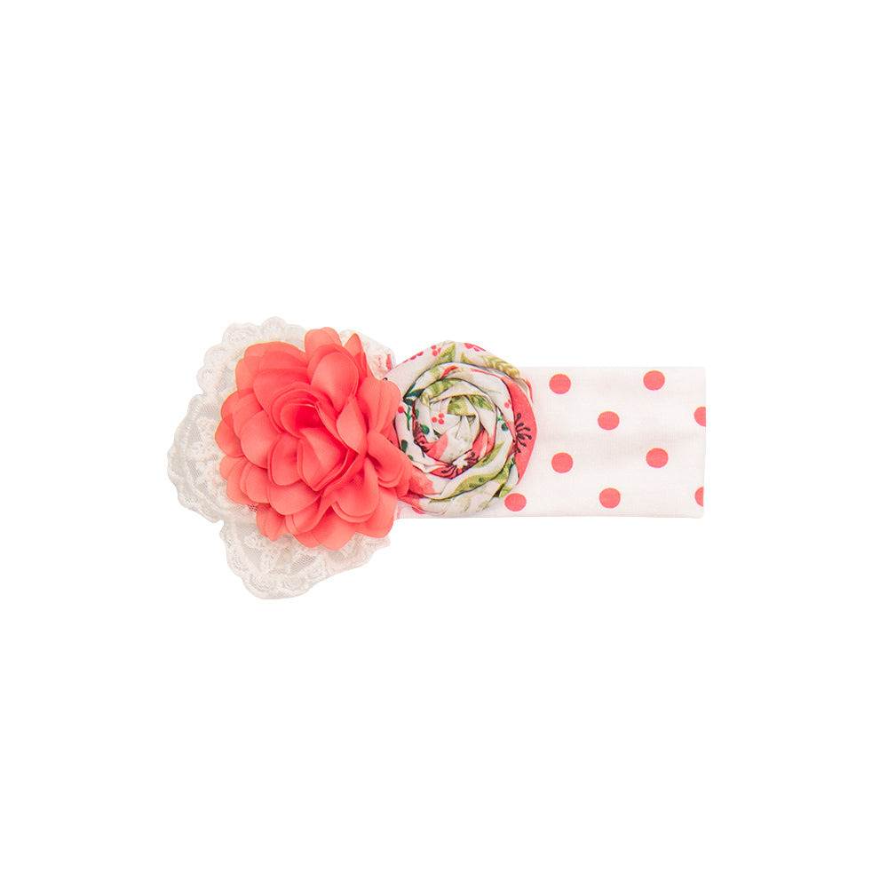 A vibrant Poppy Garden Headband featuring colorful poppy flowers on a comfortable band, perfect for stylish hair accessories.