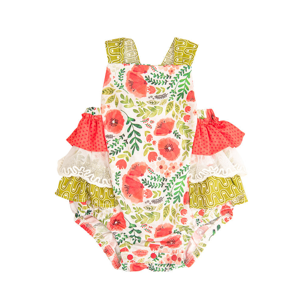 A colorful Poppy Garden Sunsuit featuring a vibrant floral print, designed for children to wear during sunny outdoor activities.