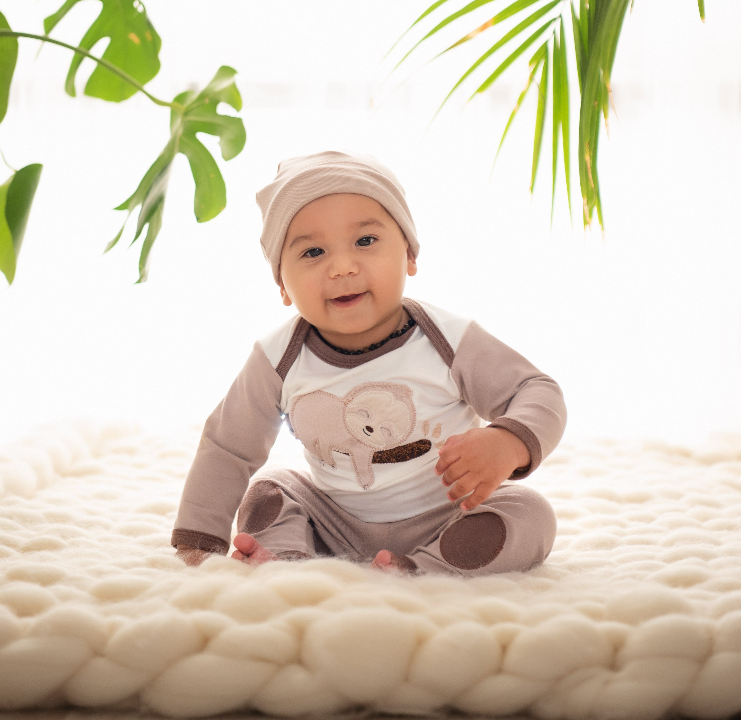 Soft and adorable Sleepy Sloth Cap for baby boys, featuring a cute sloth design.