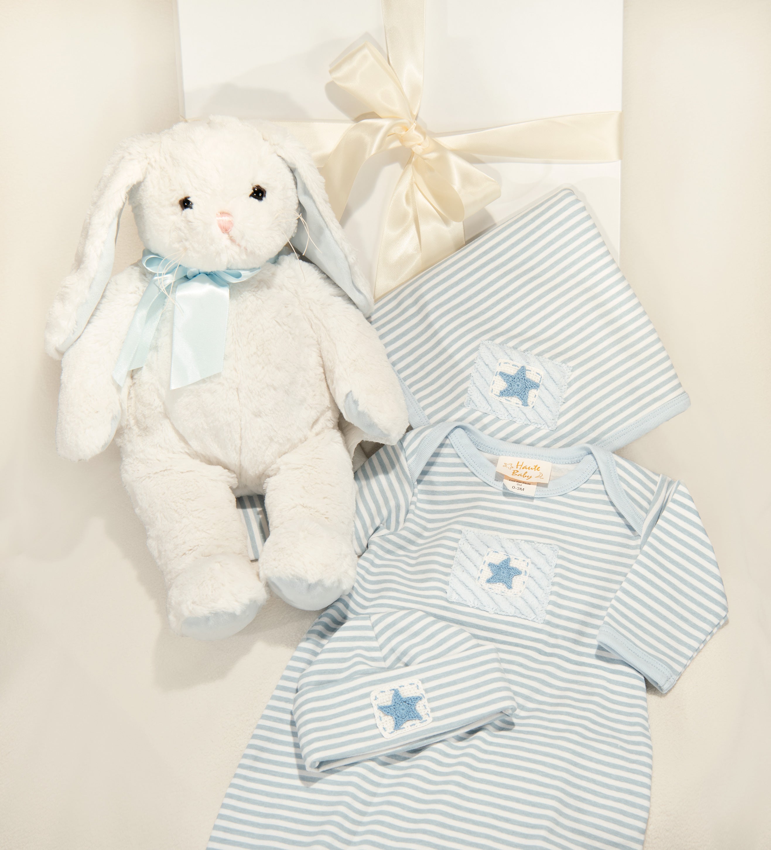 Star Is Born Gown Set featuring a gown, blanket, cap, and plush toy, designed for newborns and infants.