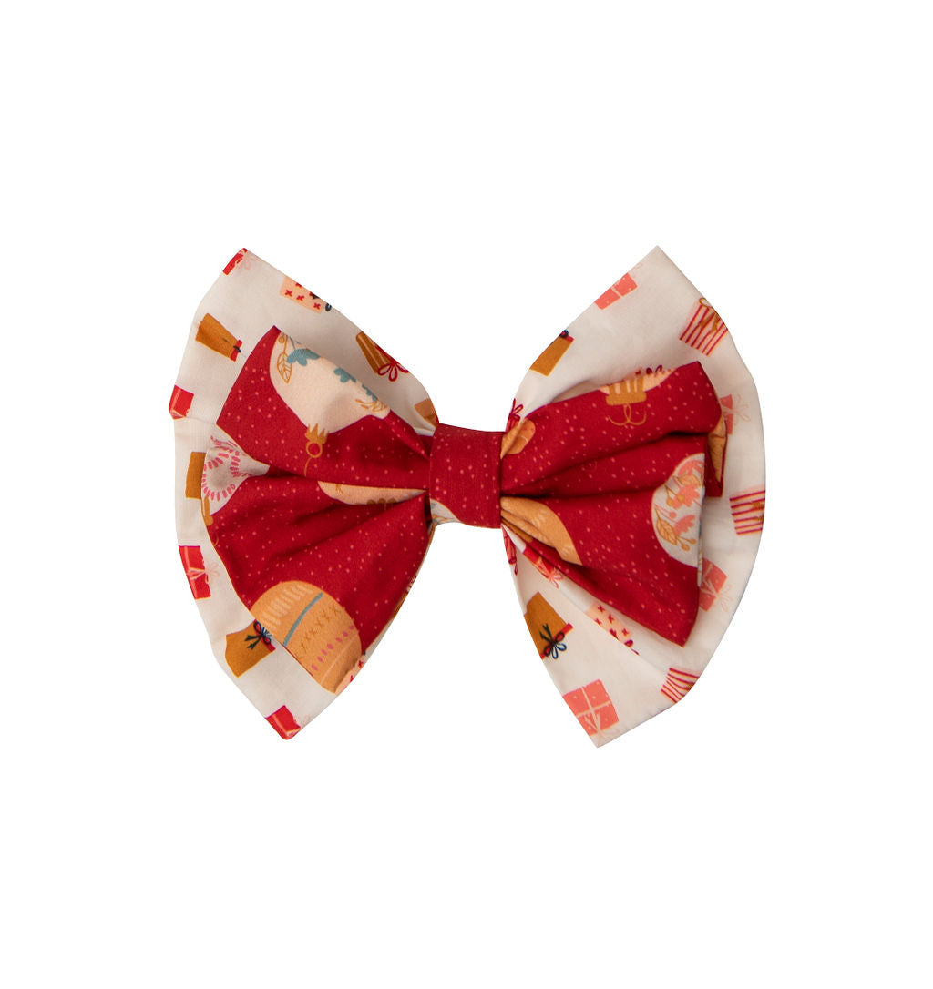 A colorful headband featuring a whimsical gift pattern, perfect for holiday celebrations.