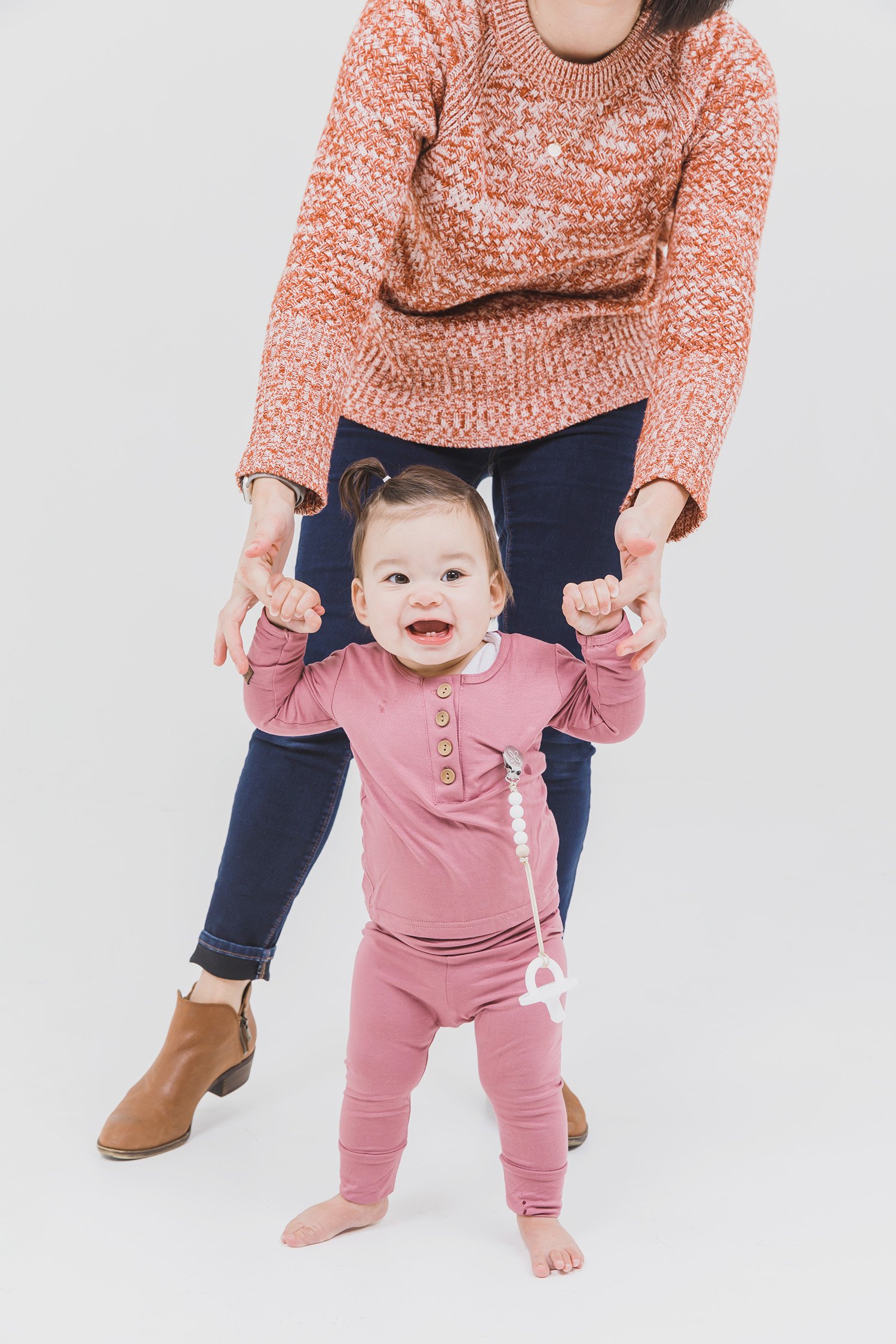 A cute baby outfit set featuring a soft fabric blend with functional wooden buttons, designed for comfort and style for infants.