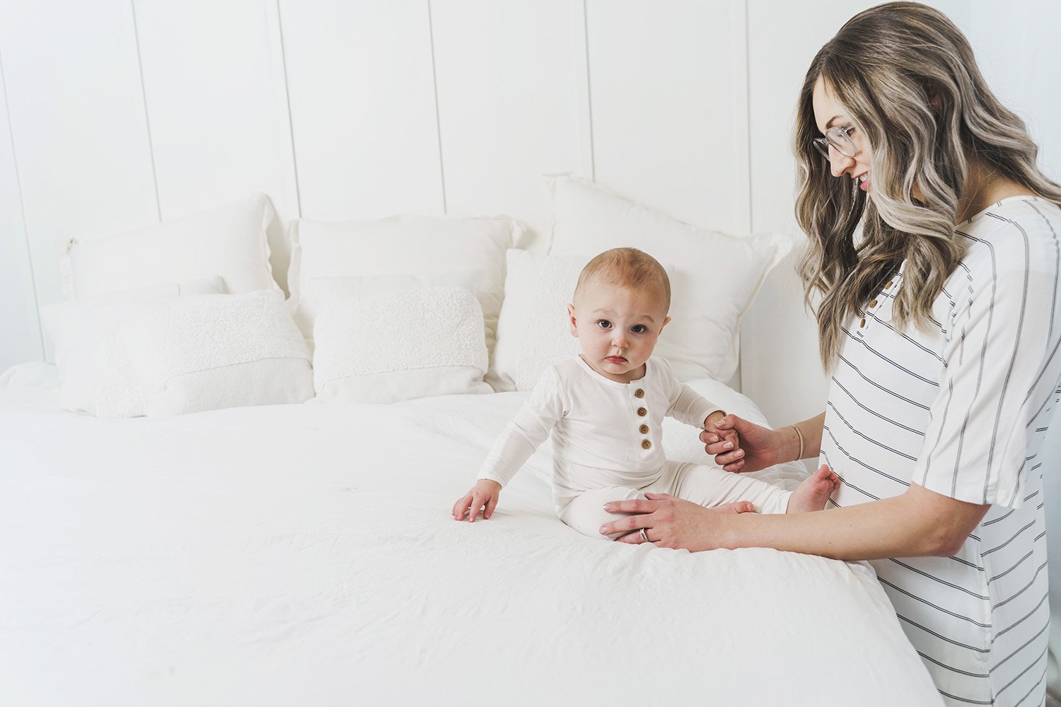 A cute baby outfit set featuring a soft fabric blend with functional wooden buttons, designed for comfort and style for infants.