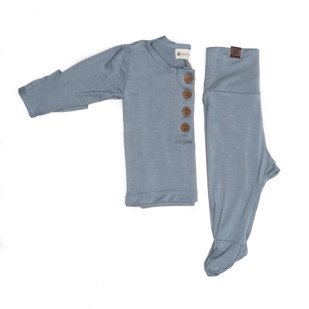 A cute baby outfit set featuring a soft fabric blend with functional wooden buttons, designed for comfort and style for infants.